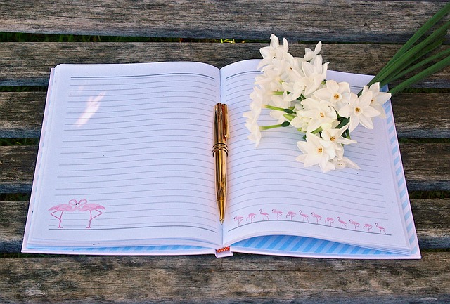 Notebook page with line spacing guides and handwriting drills